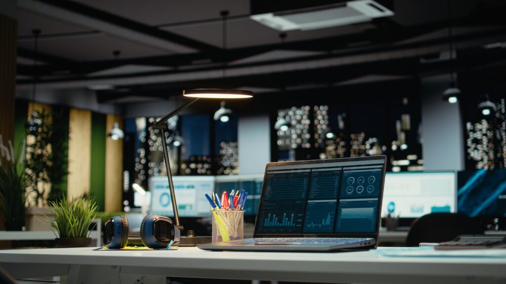 luxurious modern office space with important reports on laptop luxurious modern office space with important reports on laptop